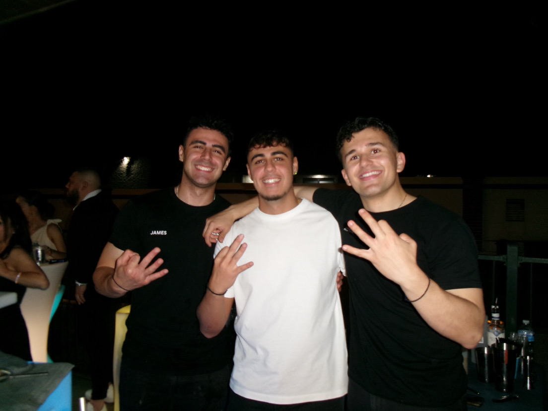Three friends at the bar at night