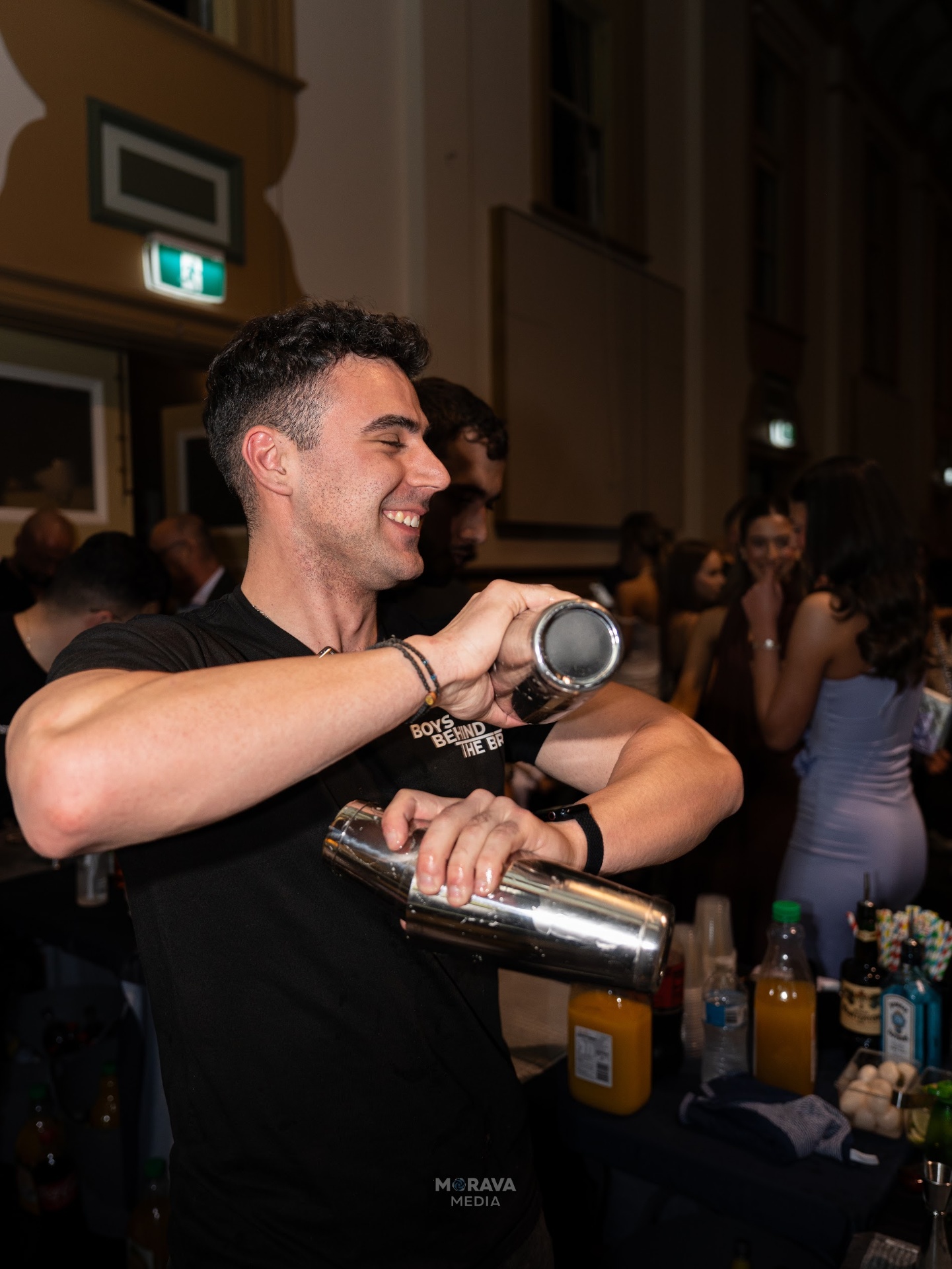 Bartender pouring cocktail at event