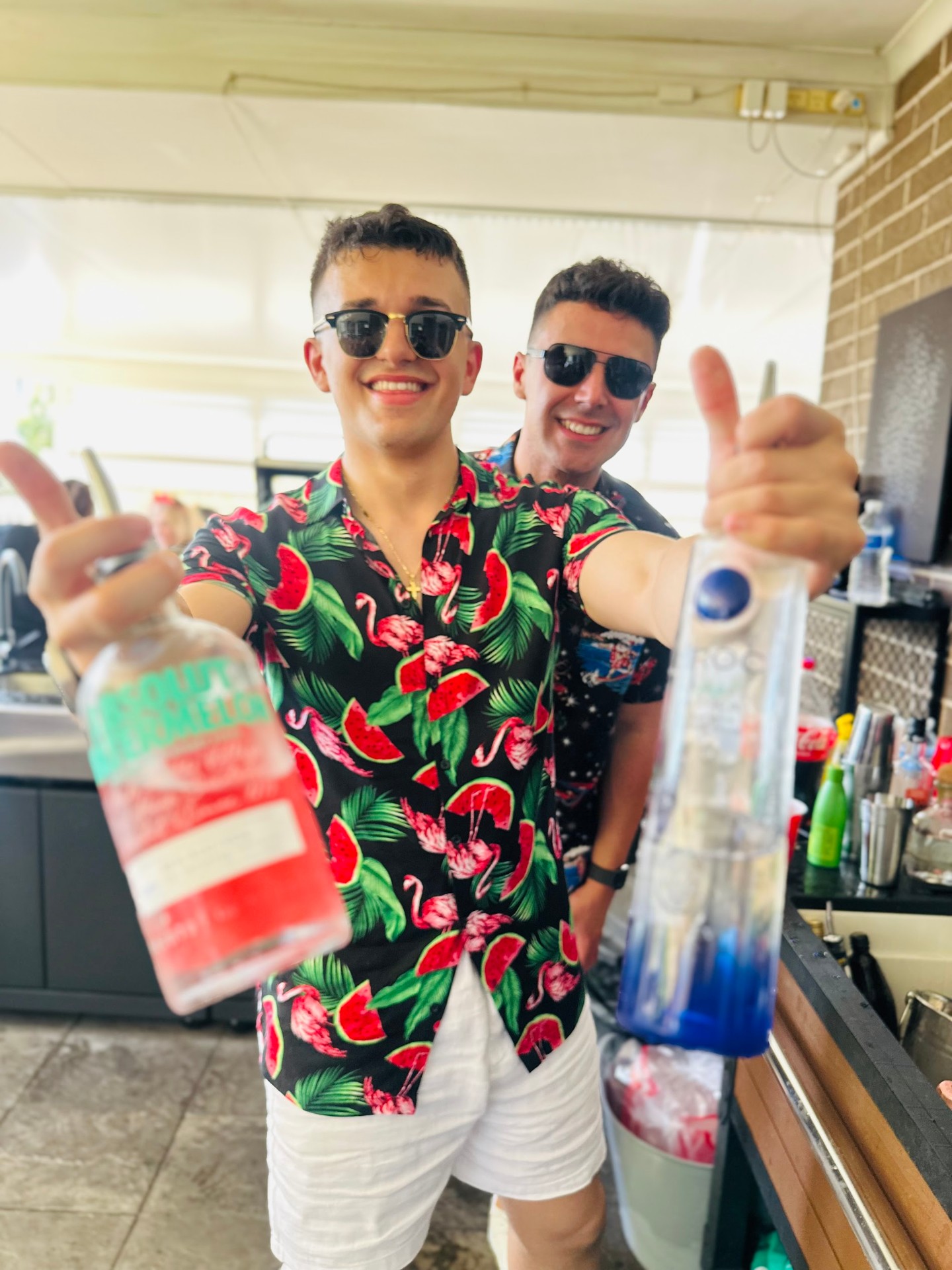 Boys behind the bar in tropical attire